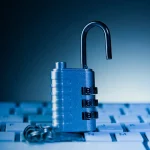 The Hidden Cost of Security Sprawl (and Why It’s Time to Clean House) - padlock on computer keyboard. Cyber security and data protection concept.