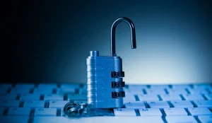 The Hidden Cost of Security Sprawl (and Why It’s Time to Clean House) - padlock on computer keyboard. Cyber security and data protection concept.